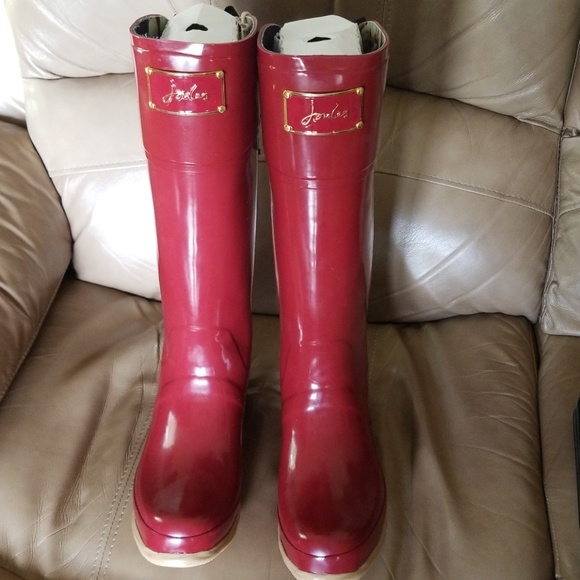 red rain boots with bow on back
